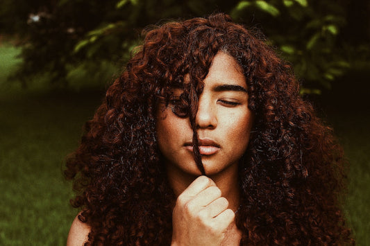 Woman with brown curly hair